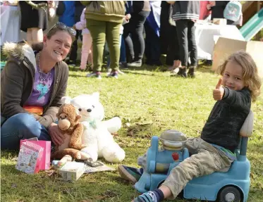  ??  ?? Skye Solomon and her son Kai with some of his prizes.