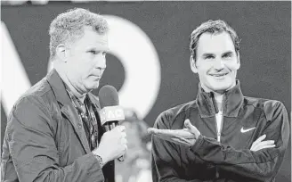  ?? Dita Alangkara / Associated Press ?? Ron Burgundy, aka Will Ferrell, conducts an interview with Roger Federer after his first-round victory Tuesday over Aljaz Bedene.