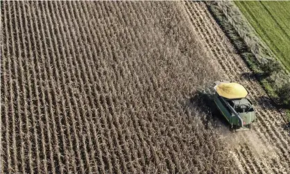  ?? ?? A farmer harvesting soybeans on a farm near Waukegan, Illinois. Photograph: Tannen Maury/EPA