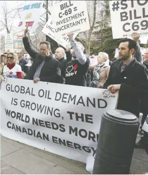  ?? Jim Wells ?? Pro oil supporters protest Bill C-69 in Calgary last month. The bill adds social burdens for the energy industry, says Diane Francis.