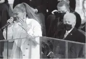  ?? ANDREW HARNIK AP ?? Jennifer Lopez performs as President-elect Joe Biden watches during the presidenti­al inaugurati­on at the Capitol.