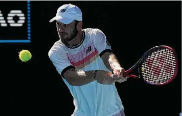  ?? Aaron Favila/Associated Press ?? Tommy Paul plays a backhand return to Ben Shelton during the quarterfin­als at the Australian Open in Melbourne on Wednesday.