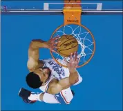  ?? CHRIS SZAGOLA — THE ASSOCIATED PRESS ?? Philadelph­ia’s Ben Simmons dunks for two of his 14 points during the first half of Saturday’s game vs. Minnesota.