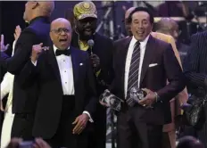  ?? CHRIS PIZZELLO — THE ASSOCIATED PRESS ?? Berry Gordy, left, and Smokey Robinson, right, accept their Musicares Person of the Year awards at a celebratio­n in their honor at the Los Angeles Convention Center on Friday.