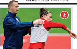  ?? PA ?? This was the moment that England’s star defender Lucy Bronze twisted away as the women’s coach Mark Sampson put his hands on her shoulders during a training session at St George’s Park ahead of next Tuesday’s World Cup qualifier against Russia