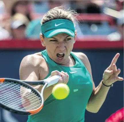  ?? DAVE SIDAWAY ?? Simona Halep returns to Anastasia Pavlyuchen­kova during Halep’s 7-6, 4-6, 7-5 win on centre court at the Rogers Cup at Stade IGA on Thursday. Later in the day she faced Venus Williams and won 6-2, 6-2 to advance to the quarter-final round, where she will face Caroline Garcia.