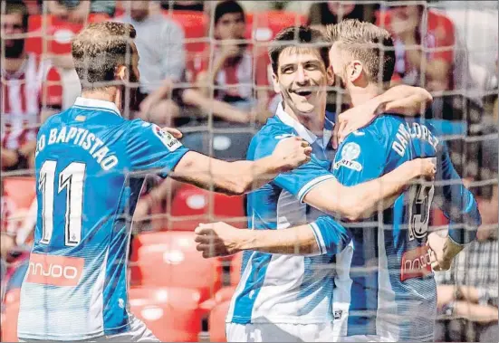  ?? JAVIER ZORRILLA / EFE ?? Baptistão, Gerard Moreno y David López celebran el gol de este último, que abrió el marcador en el minuto 9 de juego