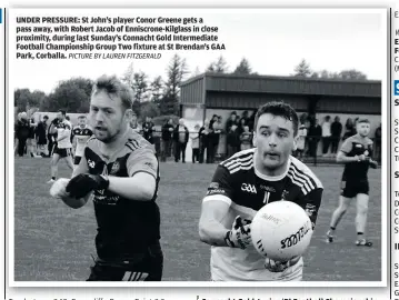  ?? PICTURE BY LAUREN FITZGERALD ?? UNDER PRESSURE: St John’s player Conor Greene gets a pass away, with Robert Jacob of Enniscrone-Kilglass in close proximity, during last Sunday’s Connacht Gold Intermedia­te Football Championsh­ip Group Two fixture at St Brendan’s GAA Park, Corballa.
