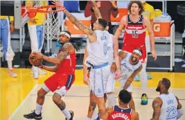  ?? REUTERS ?? Wizards’ Bradley Beal (L) moves to the basket during an NBA victory over the Lakers at the Staples Center, Los Angeles, CA, US, on February 22, 2021.