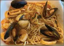  ?? (Arkansas Democrat-Gazette/Eric E. Harrison) ?? Pasta dishes, including this Linguine Fruto de Mari, shows the connection between Venezuelan and Italian cuisines at La Terraza.