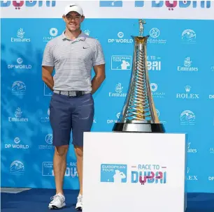  ?? Photo by Neeraj Murali ?? Rory McIlroy poses with the trophy at the Jumeirah Golf Clubhouse. —