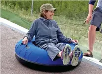  ?? COURTESY EDEN IVIE VIA THE AP ?? Melody Ivie of Farmington rides a tube during a family vacation in Colorado in 2021. Ivie, 73, was one of the people killed when a gunman opened fire on a street May 15.