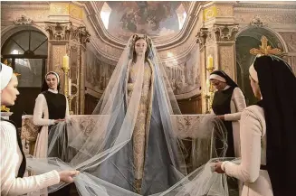  ?? Neon Pictures/Tribune News Service ?? In “Immaculate,” Sydney Sweeney, center, stars as Sister Cecilia, who has traveled to Italy to take her vows at a secluded convent where she will care for elderly nuns.