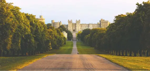  ?? CRAIG EASTON/VISIT BRITAIN ?? Britain's Windsor Castle is a historic palace and military fort, which is still one of the main homes of the British monarch. The Long Walk is a ceremonial road lined with trees overlooked by the castle on a rise above Windsor Great Park. Jubilee exhibits at Windsor Castle will focus on the Queen's 1953 coronation.