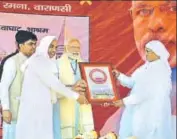  ?? HT PHOTO ?? Saints of the Garhwa Ghat Ashram welcome Prime Minister Narendra Modi in Varanasi, Uttar Pradesh, on Monday.