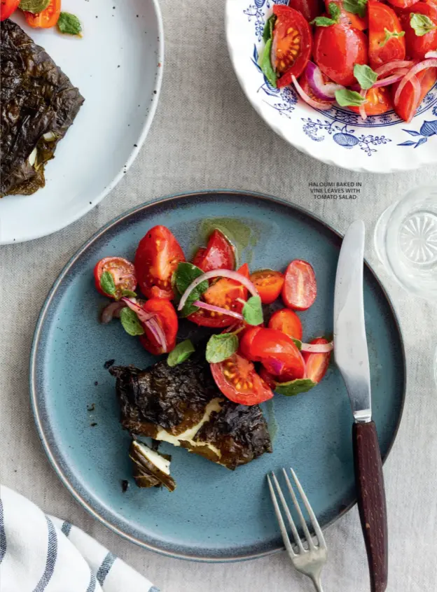  ??  ?? HALOUMI BAKED IN VINE LEAVES WITH TOMATO SALAD