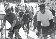  ?? BEN GOFF NWA DEMOCRAT-GAZETTE ?? Riders wear helmets during the Square To Square ride in May on the Razorback Greenway. Helmets and cycling gloves help prevent rider injury.