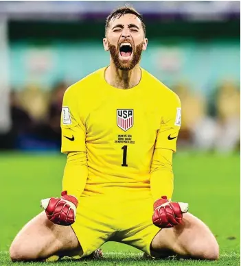  ?? ?? United States' goalkeeper Matt Turner celebratin­g after defeating Iran in the World Cup group B soccer match between Iran and the United States at the Al Thumama Stadium in Doha, Qatar, Tuesday, Nov. 29, 2022. (AP Photo/Ashley Landis)