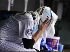  ?? ANDY CROSS — THE DENVER POST ?? Colorado Rockies starting pitcher Austin Gomber sits in the dugout after being pulled by manager Bud Black in the fifth inning against the San Diego Padres at Coors Field on June 9.