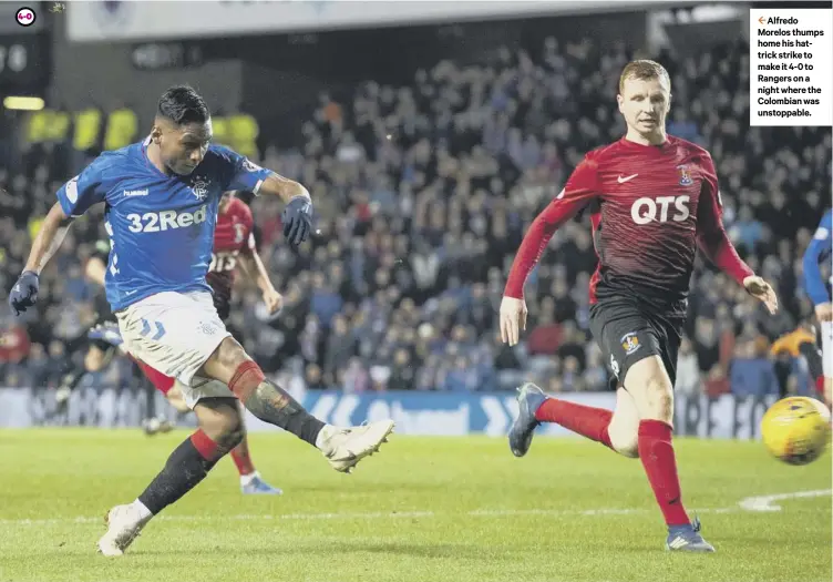  ??  ?? 2 Alfredo Morelos thumps home his hattrick strike to make it 4-0 to Rangers on a night where the Colombian was unstoppabl­e.