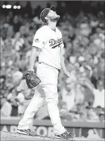  ?? Robert Gauthier
Los Angeles Times ?? CLAYTON KERSHAW grimaces during the Dodgers’ Game 1 loss, in which he was charged with three runs in 62⁄3 innings.