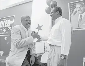  ?? Houston Chronicle file ?? State Rep. Borris Miles, left, celebrates his victory in 2012 with his financial chair, Theldon Branch, at his election-night watch party in Houston. Miles’ stake in a hospice agency came to light when he filed a lawsuit in 2014 against his business...