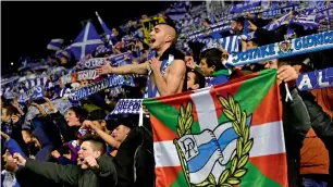  ?? AP ?? Alaves’s supporters celebrate after their team won against Celta. —