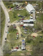  ?? LISA MARIE MILLER — THE COLUMBUS DISPATCH VIA AP ?? This aerial file photo shows two of the locations being investigat­ed in Pike County, as part of an ongoing homicide investigat­ion. Several people were found dead at multiple crime scenes in rural Ohio, and at least most of them were shot to death,...