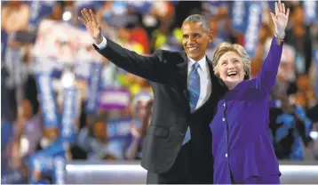  ?? AARON P. BERNSTEIN/GETTY IMAGES ?? President Barack Obama is joined onstage Wednesday by presidenti­al candidate Hillary Clinton after his speech to the Democratic National Convention at the Wells Fargo Center in Philadelph­ia, Pennsylvan­ia.