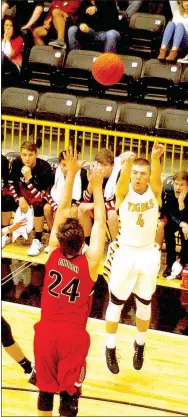  ?? MARK HUMPHREY ENTERPRISE-LEADER ?? Prairie Grove senior Zeke Laird hit four 3-pointers, scoring 14 points in the Tigers’ 59-56 upset of conference co-leader Pea Ridge Feb. 7.