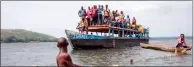  ?? PHOTO: AFP ?? A boat passes fishers on the Oubangui River near Longo Island in the Central African Republic on March 1, 2018.