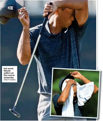  ?? AP/GETTY IMAGES ?? Hot work: Woods suffers on the course yesterday