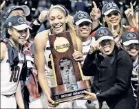 ?? AP ?? MISSION COMPLETE: Kaela Davis, A’ja Wilson and coach Dawn Staley (left to right) celebrate South Carolina beating Mississipp­i State on Sunday for the national championsh­ip.