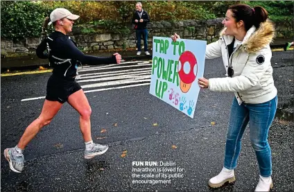  ?? ?? FUN RUN: Dublin marathon is loved for the scale of its public encouragem­ent