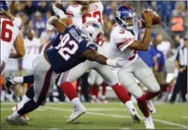  ?? THE ASSOCIATED PRESS ?? Giants quarterbac­k Geno Smith (3) tries to scramble away from Patriots defensive end Geneo Grissom (92) during Thursday’s preseason finale in Foxborough, Mass.