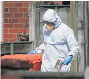  ?? DANNY LAWSON / PA VIA AP ?? Police forensic investigat­ors search the home of suspected suicide bomber Salman Abedi in connection with Monday night’s explosion at Manchester Arena.