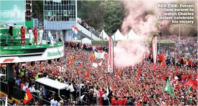  ??  ?? RED TIDE: Ferrari fans swarm to watch Charles Leclerc celebrate his victory