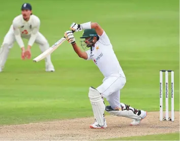  ?? Reuters ?? Classy Pakistan batsman Babar Azam plays his trademark cover drive during his unbeaten 69 on the opening day of the first Test against England at Old Trafford in Manchester yesterday.