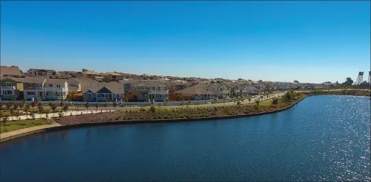  ??  ?? River Islands in Lathrop is a 5,000-acre master-planned community on the San Joaquin River with homes, lakes, parks, trails, schools and a restaurant.