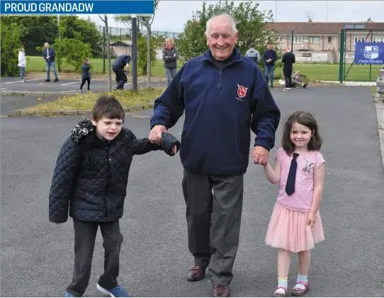  ??  ?? Pat McGuinness with his grand children James and Rachel Barry at the Muirhevnam­ór FC fundraiser ’Run 24 with Muirhevnam­ór’ for Cuidigh Linn.