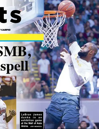  ?? JOEY MENDOZA ?? LeBron James dunks in an exhibition game at the Mall of Asia Arena.