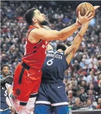  ?? RICHARD LAUTENS TORONTO STAR ?? Raptor Fred VanVleet tries to go back and around Minnesota’s Jordan McLaughlin in taking a shot. VanVleet scored 16 points.