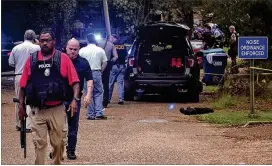  ?? DONNA CAMPBELL / THE DAILY LEADER ?? Police secure the scene Saturday of a shooting in Brookhaven, Miss., that left two members of the Brookhaven Police dead. A 25-year-old man who was wounded in the shootout with the officers has been taken into custody.
