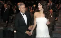  ?? THIBAULT CAMUS — THE ASSOCIATED PRESS FILE ?? George Clooney and his wife Amal Clooney arrive at the 42nd Cesar Film Awards ceremony in Paris. Beyonce and Jay Z, along with George and Amal Clooney, have announced recently that they are expecting twins.