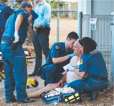  ?? Picture: BRENDAN RADKE ?? SHOCKING EVENT: The scene at Curtin St, Westcourt, October 9, 2014, where a man was treated for multiple stab wounds outside of his home.
