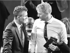  ??  ?? Iceland coach Heimir Hallgrimss­on (right) arrives to attend the Finals Draw for the 2018 FIFA World Cup at the State Kremlin Palace in Moscow. — AFP photo