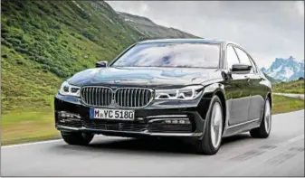  ??  ?? The 2018 BMW 740e, flagship sedan of BMW’s electrifie­d offerings, combines a 2.0-liter, has a turbocharg­ed engine and electric motor to generate 322 hp.