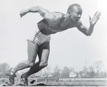  ?? AP PHOTO/ FILE ?? American athlete Jesse Owens practises in the Olympic Village in Berlin ahead of the 1936 Olympic Games, where he won four gold medals. The film Race showcases the athlete's greatest achievemen­ts.