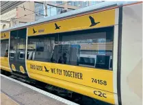  ?? C2C ?? GOING FOR GOLD: C2C Class 357 electric unit No. 357008 has had bodyside vinyls applied in support of Leigh-on-Sea charity Gold Geese, which provides help to children living with cancer and their families. The unit is pictured on September 1 at Fenchurch Street station.