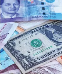  ??  ?? THE PESO slipped further on Thursday as the Trump-Comey saga continued to unravel and following disappoint­ing Philippine economic growth data.